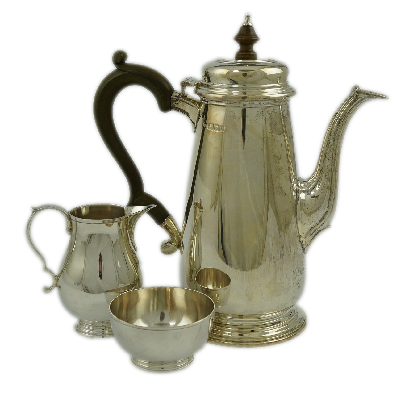 An Elizabeth II matched silver three piece coffee set by William Comyns & Sons Ltd